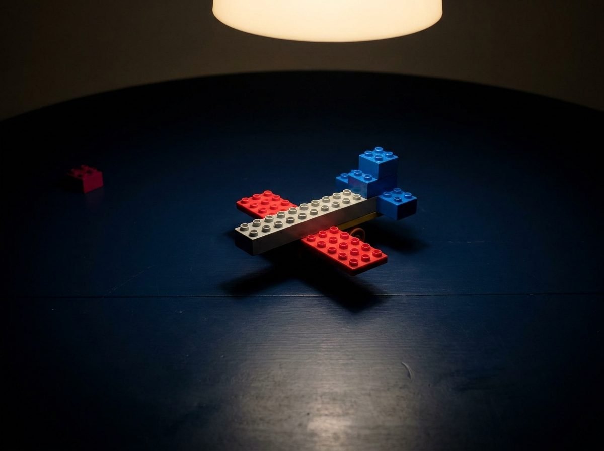 A crude toy airplane snapped together from a handful of plastic bricks